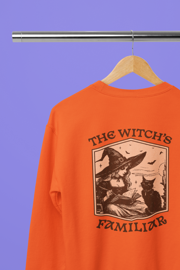 mockup-of-a-gildan-crewneck-sweatshirt-placed-on-a-hanger-against-a-colorful-backdrop-m37118.png